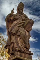 Fototapeta premium Statue of Adalbert of Prague at Charles Bridge in PRague, Czech Republic