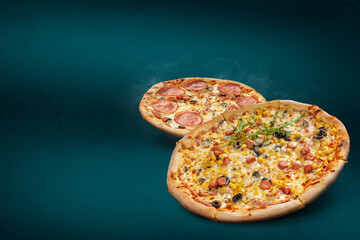 Floating, smoking pizzas on a turquoise background