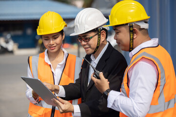 Asian Manager with His Engineer Team Havina a Team Discussion Meeting at an Industrial Site