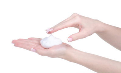 White foam mousse on hand on white background isolation