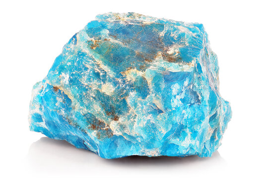 Macro shoot of piece of raw uncut Blue Apatite Mineral stone isolated on white background. Closeup photo of amazing natural turquoise specimen mineral rough.