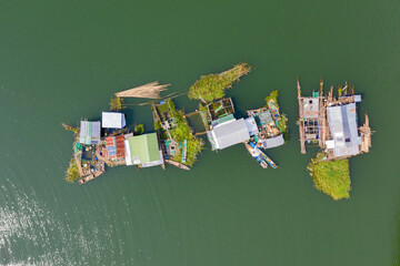 Floating local Fishing Village Houseboats with Fish Farms aerial view
