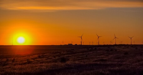 Wind turbines at sunset in the state of Idaho, Scenic view of wind turbines power generator