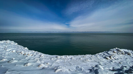 Frozen ice, water, and sky on the Lake Michigan horizon