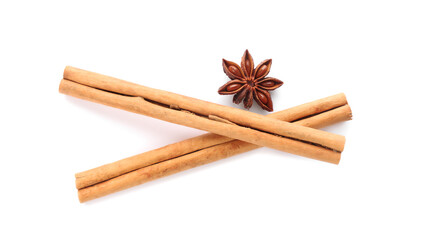 Aromatic cinnamon sticks and anise isolated on white, top view
