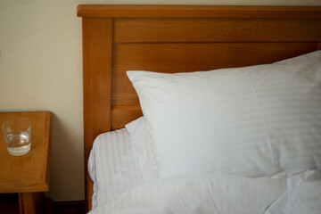 bed with pillows, pillows in the hotel, fresh clean linen on the bed, a hotel room ready for guests, service in a motel