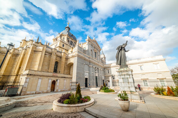 Fototapeta premium Side view of Almudena cathedral under a dramatic sky