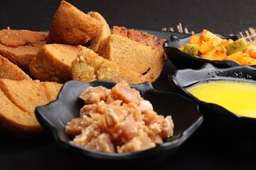 bafle or bati is popular main course dish in India served with dal daal brinjal curry jaggery gud...