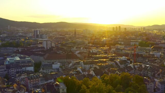 Pretty sunrise in Zurich, Switzerland in summer, taken by drone flying backward