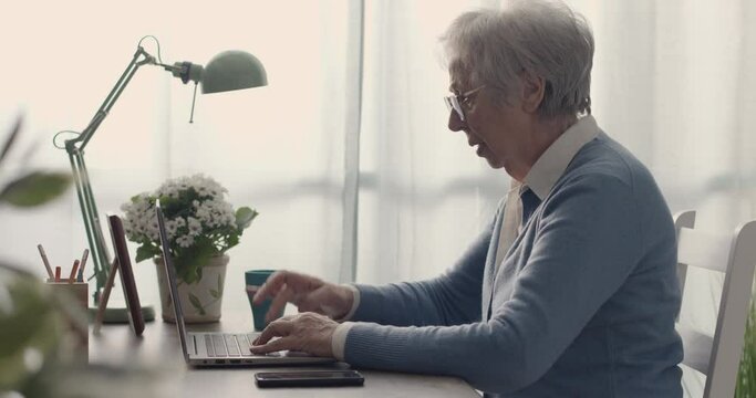 Frustrated senior woman having problems with her computer