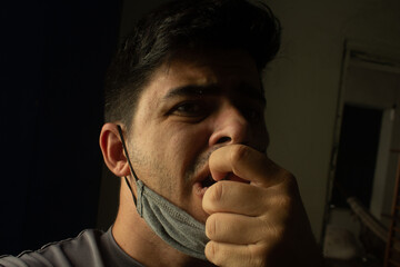 man with a finger on his face