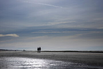 Fototapeta na wymiar Going for a walk at the beach in winter. Julianadorp Northsea coast Netherlands.