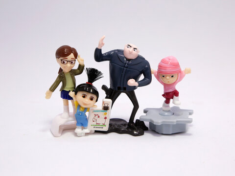 Gru with his daughters Agnes, Edith and Margo. Minions. Gru. Villain Gru. Family of Gru. Characters from the famous Despicable Me movies. Kinder Egg Toys.