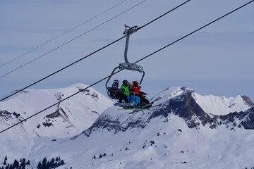 Fototapeta na wymiar Chairlift at Swiss ski resort with pole. Photo taken at Hoch-Ybrig, Switzerland, February 15th, 2021.