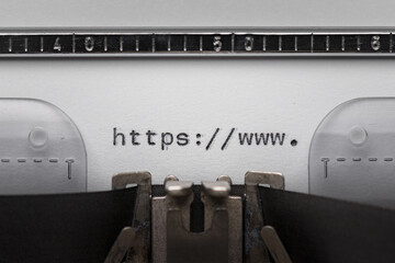Typing text http www on vintage manual typewriter. Close up of writes word on white paper. Shot in...