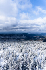 Stunning view from the peak of a mountain on a cold cloudy day.