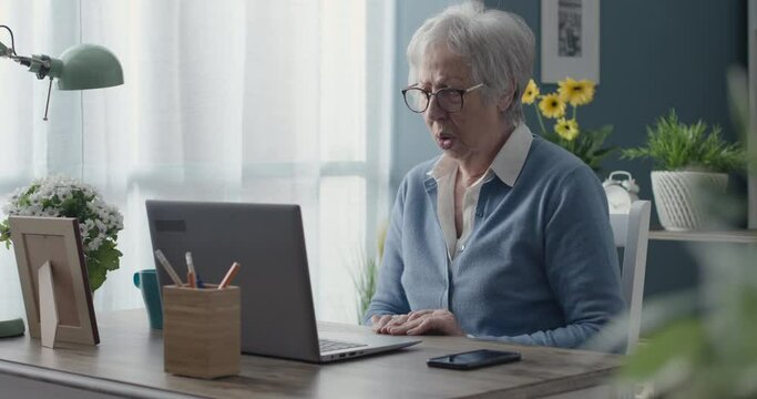 Senior lady having problems with her computer