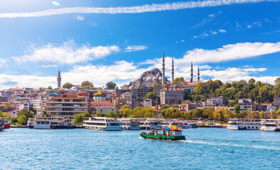 Eminonu Pier with Ships and Suleymaniye Mosque on the background, view from the Golden Horn inlet,...
