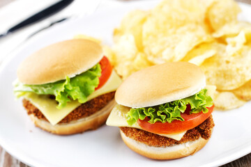 Mini Crispy Chicken Burger with Lettuce Tomato and Cheese.