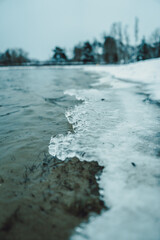 partial frozen lake in winter