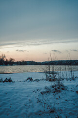 sunset over the river in snow