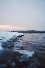 partial frozen lake in winter