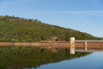 Apartadura dam nature landscape with reflection on the still water in Sao Mamede, Alentejo, Portugal