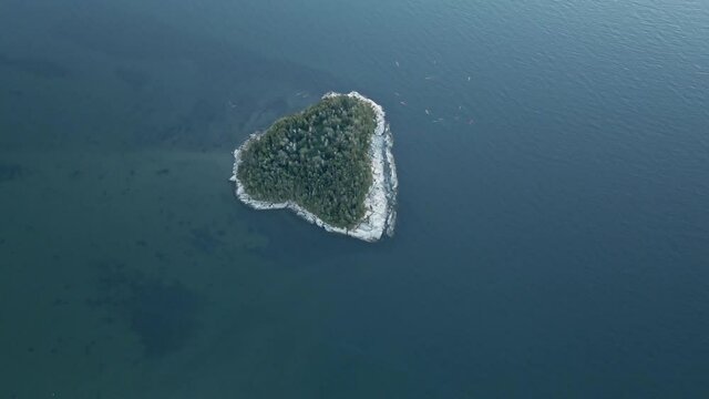Aerial Footage of People in Kayak by a Small Island in Bic National Park, Quebec.