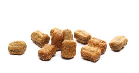 Dry dog food with bacon, granules isolated on white background