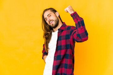 Young man with long hair look cheering carefree and excited. Victory concept.