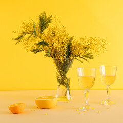 Realistic decorative valentines party with fresh fruits, lemon and grape and two glasses of wine on yellow background.