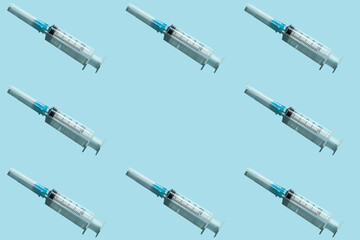 Medical syringe on a blue background. Medical equipment.