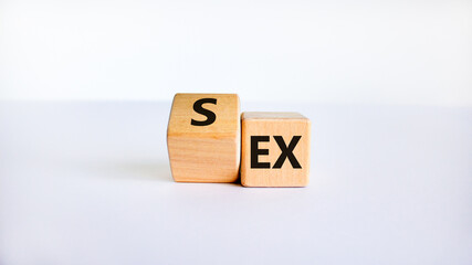 Sex with an Ex symbol. Turned a cube and changed the word 'ex' to 'sex'. Beautiful white table, white background. Psychology and Sex with an Ex concept. Copy space.