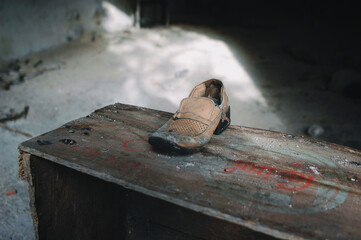 detail of a shoe abandoned and worn by time. post earthquake