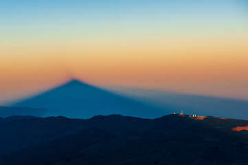 Silhouette of shadow of volcano del Teide  at sunset. Pico del Teide mountain in El Teide National park. Tenerife, Canary Islands, Spain