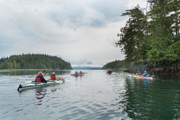 Canada, British Columbia. Sea kayakers paddle in the Broughton Archipelago near Blackfish Sound.