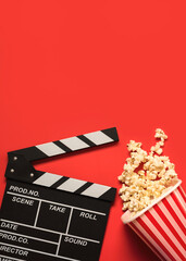 Fototapeta na wymiar movie clapperboard with popcorn with space for text. Cinema concept background