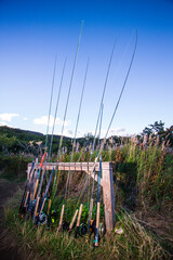 Fototapeta premium Group of fly-fishing rods stacked in a rod holder at a camp in Alaska.