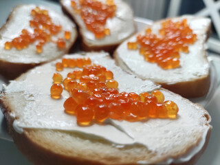 Red caviar with butter and bread, luxury breakfast food photography