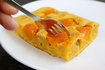 Closeup Fork Cutting a Slice of Tasty and Healthy Butternut Squash Cake Bar