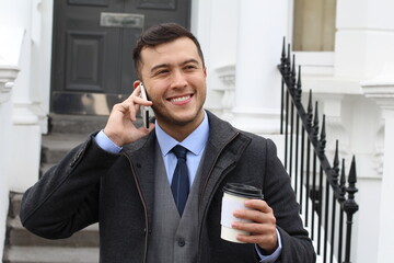 Stylish ethnic businessman calling during coffee break