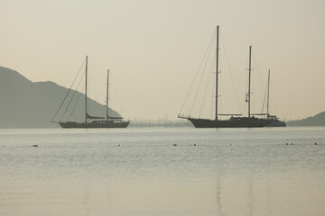 Fototapeta premium Landscape panorama with sea, yachts and mountains. Sea voyage concept.