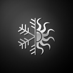 Silver Hot and cold symbol. Sun and snowflake icon isolated on black background. Winter and summer symbol. Long shadow style. Vector.