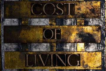 Cost of Living text on vintage textured grunge copper and gold background