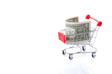 Shopping cart with 1 US dollars inside, isolated on white background. Copy space