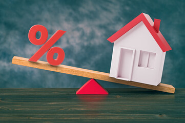 Mortgage rate balance concept, seesaw with percent and house. 3d illustration