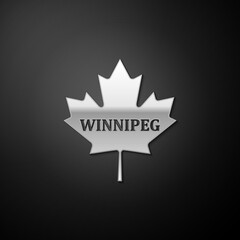 Silver Canadian maple leaf with city name Winnipeg icon isolated on black background. Long shadow style. Vector.