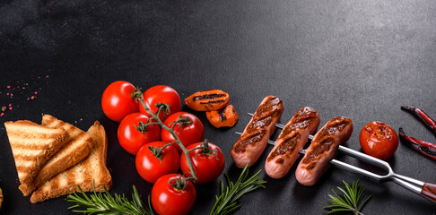 Tasty, fresh sausages grilled with vegetables spices and herbs