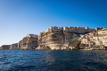 Fototapeta na wymiar View from Water to the village of Bonifacio in Corse, France, built on limestone cliffs