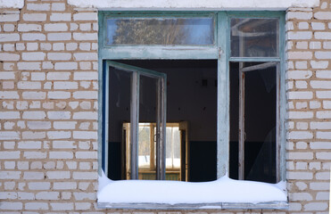 open window in an abandoned building